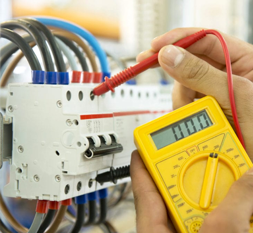 Professional electrician testing electrical wires in Orlando, FL.