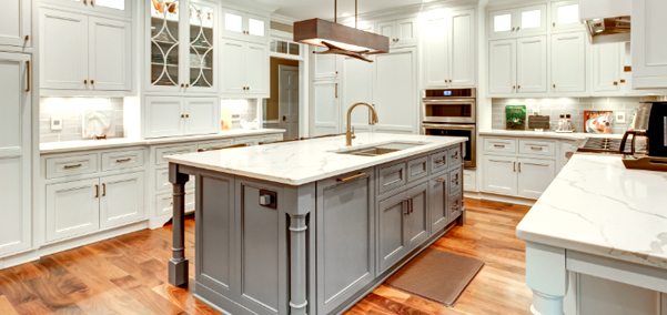 Modern custom-designed kitchen with white cabinets, wood floors, and a center island remodel by TJ Handyman Services in Orlando, FL