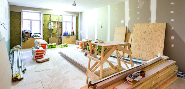 Commercial interior space under renovation with construction materials and tools in Orlando, FL by TJ Handyman Services