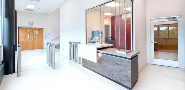 Modern commercial office remodel with glass walls and security gate by TJ Handyman Services Orlando