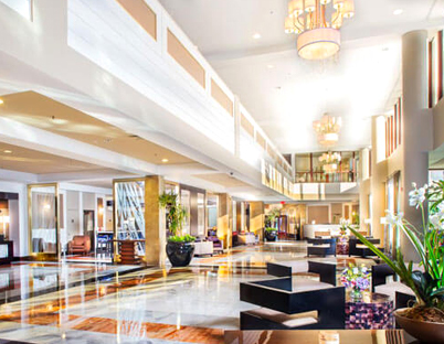 Elegant hotel lobby remodel with modern lighting, high ceilings, and luxurious furnishings by TJ Handyman Services in Orlando, FL