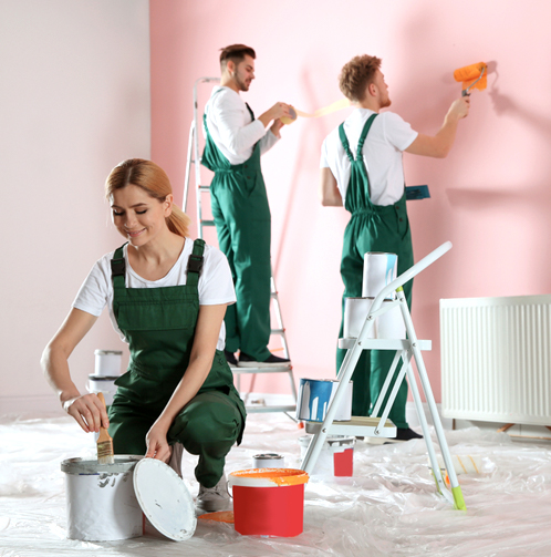 Professional painters applying interior wall paint in an Orlando, FL home