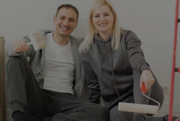 Happy Couple Doing Wall painting