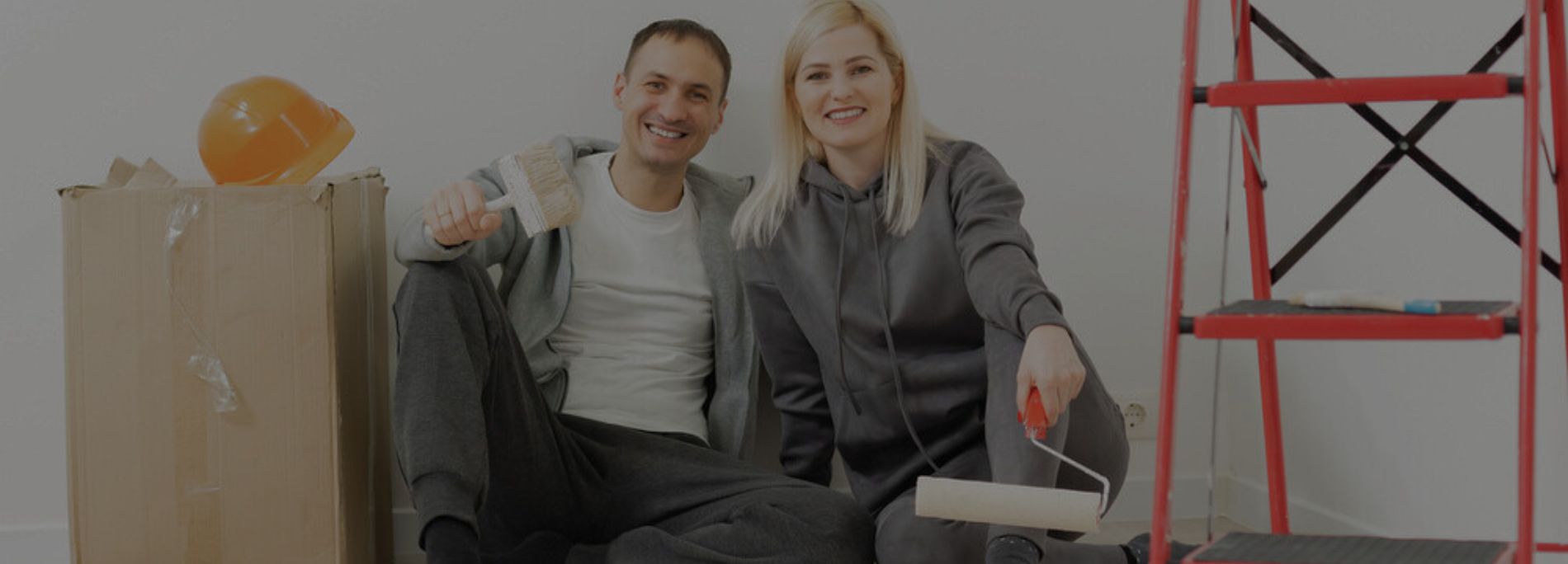 Happy Couple Doing Wall painting