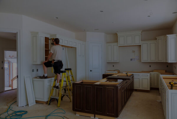 Kitchen cabinet repair by worker