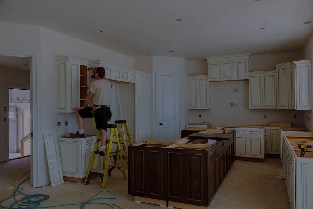 Kitchen cabinet repair by worker