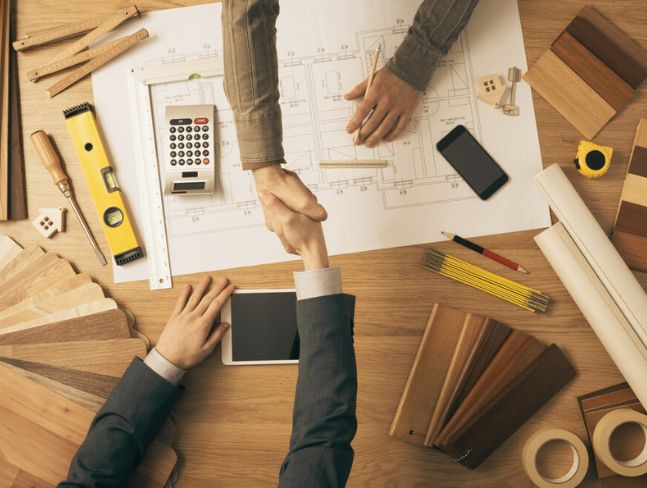 architect And Home owner shaking hands 