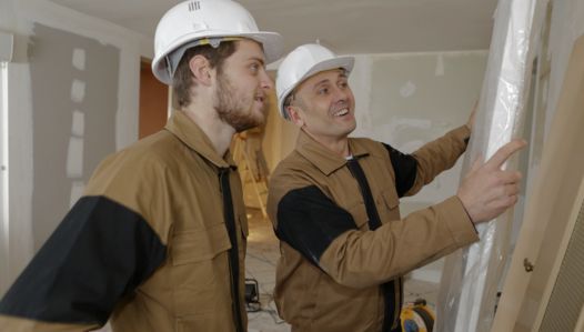 Professional painters and decorators in Orlando, FL reviewing a home renovation plan