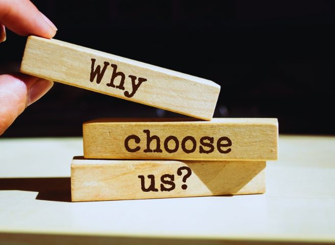 Wooden blocks stacked with text reading "Why choose us?" for promoting handyman and painting services in Orlando, FL