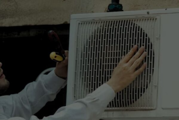 Technician repairing ac outdoor