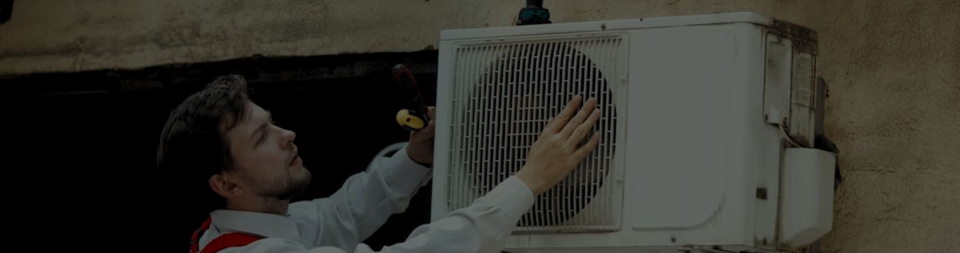 Technician repairing ac outdoor