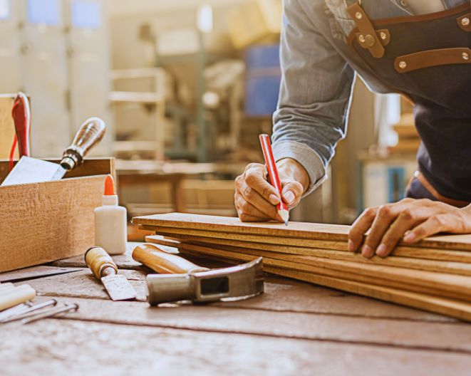 Carpenter working with equipment