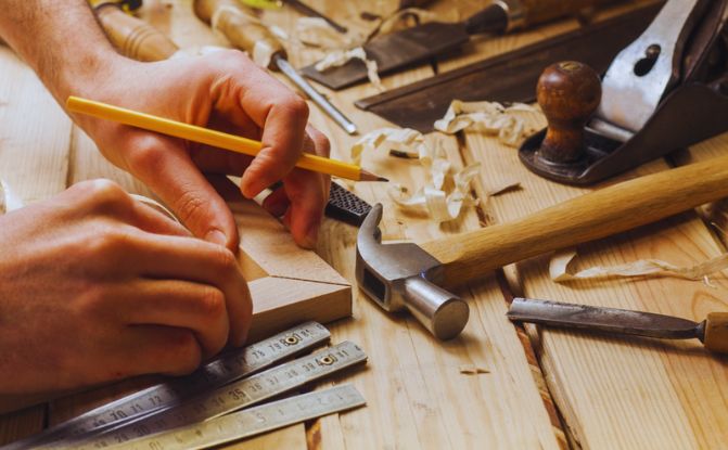 carpenter working hammer meter